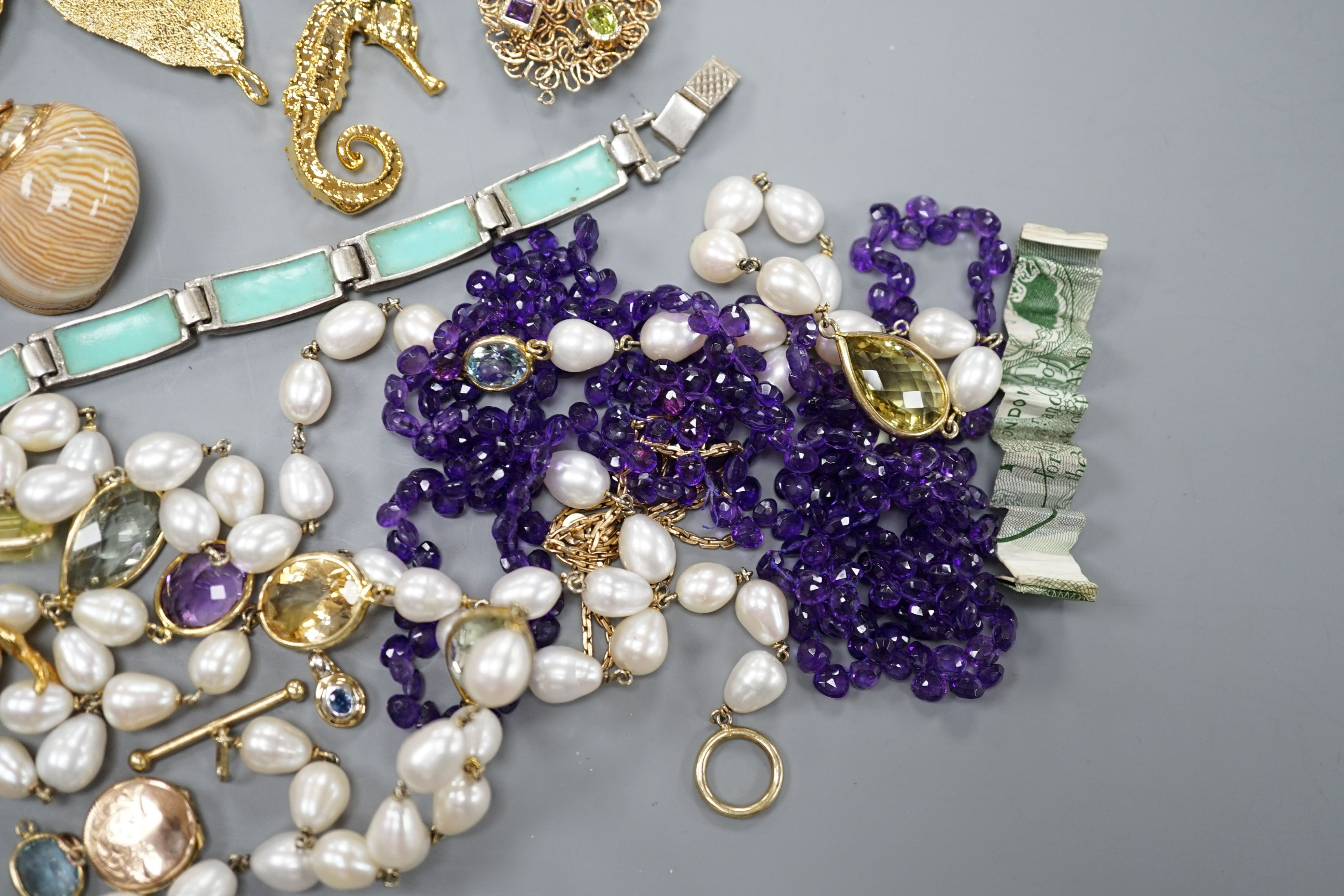 A group of minor costume jewellery including an amethyst bead necklace